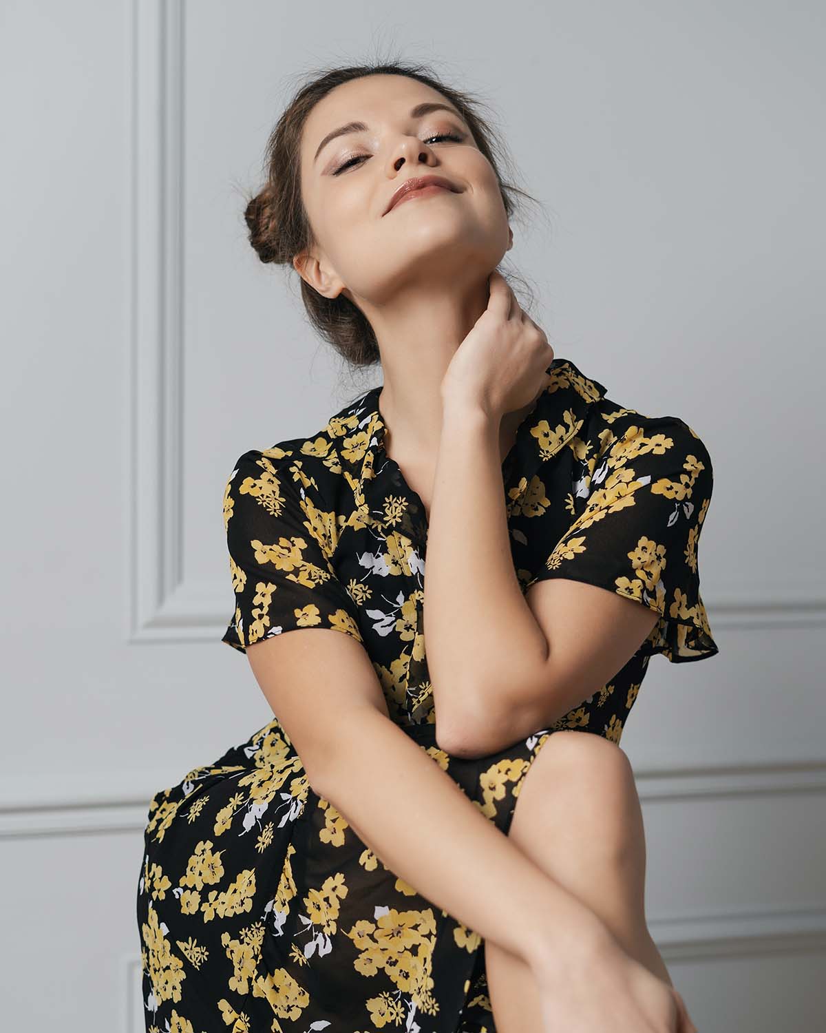 attractive-young-woman-dressed-in-floral-dress-8LKYX2Z.jpg